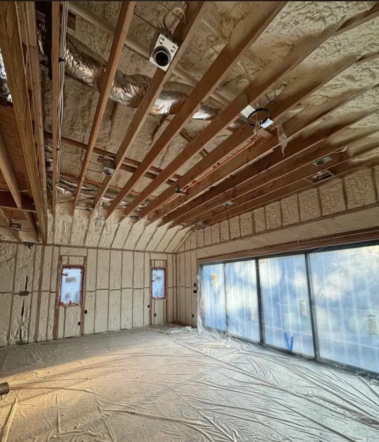 Interior walls and ceiling insulated with spray foam during new construction in South Brunswick
